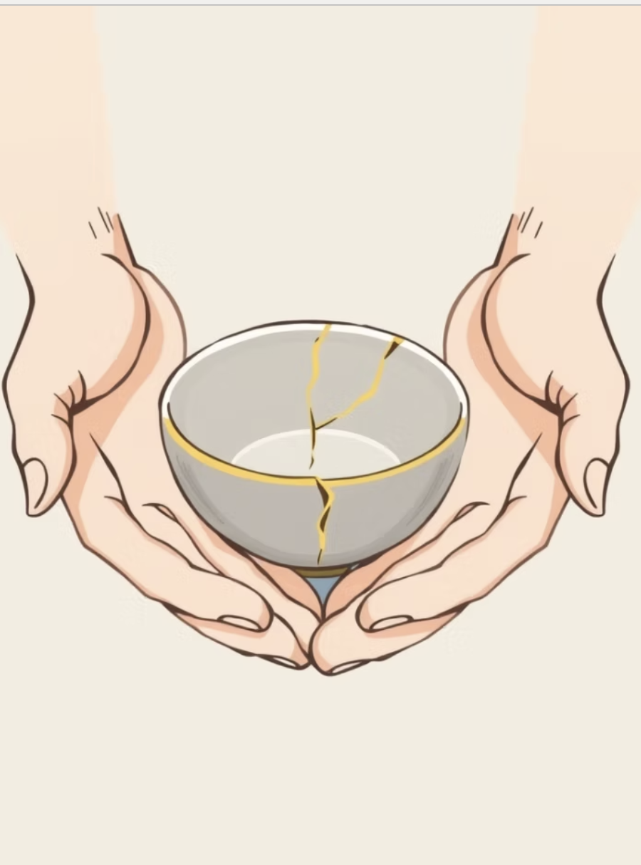 Hands cradling a kintsugi bowl repaired with gold